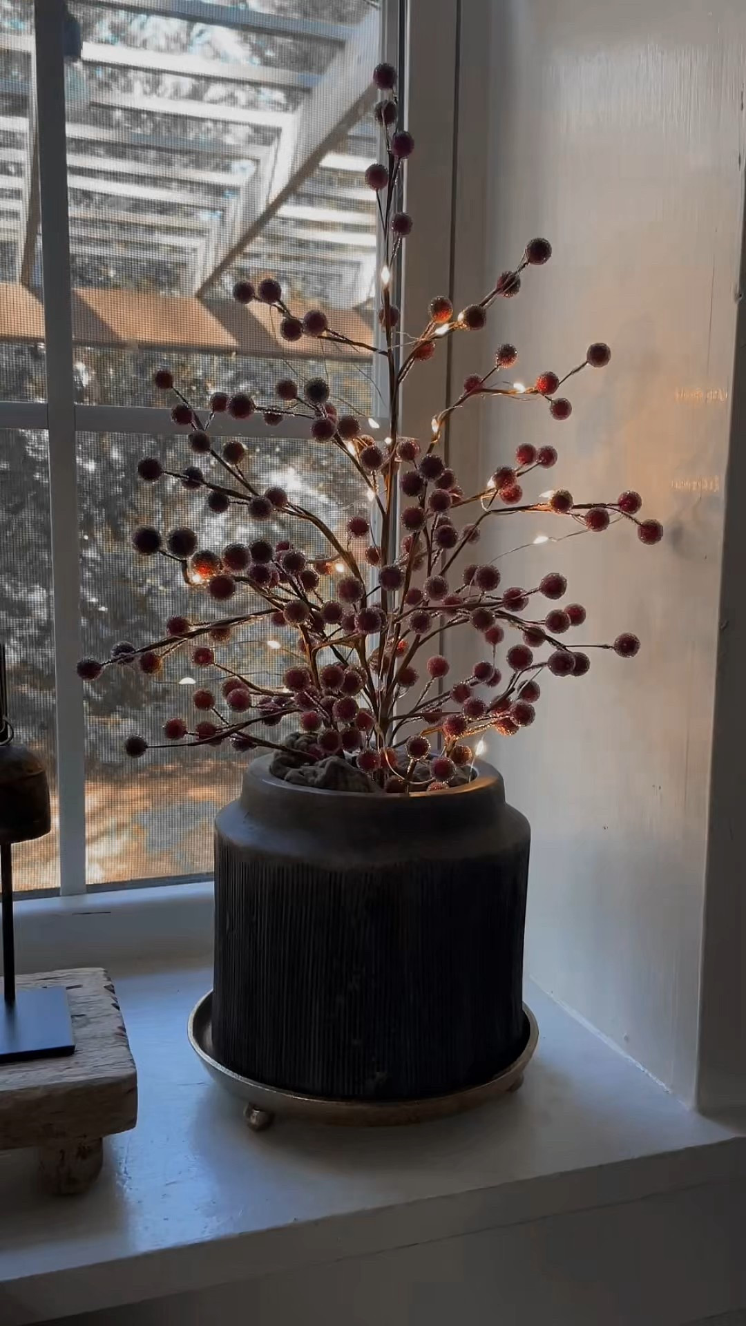 Made this little light up berry tree inspired by the pottery barn one using 5 Hobby Lobby sugared berry picks, floral tape(I twisted the stems together and staggered them for different heights), floral foam, my favorite target twinkle lights, some green gauzy fabric I had to cover the floral foam in the pot, and a Walmart planter I’ve had. LOVE how it turned out & super affordable✨♥️