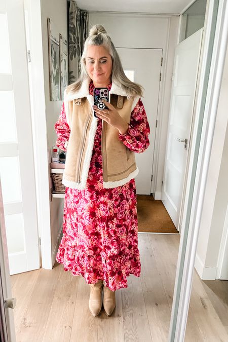 A pink floral midi dress (Norah) paired with tan western boots (old) and a lammy gilet (L)



#LTKeurope #LTKover40 #LTKmidsize