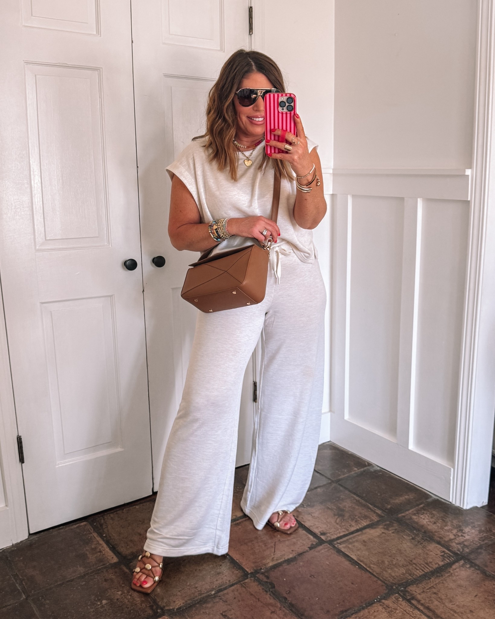 Super cozy & chic - perfect for a casual lunch with friends, errands, travel & more!
@Aerie 


These sandals are so cute with the studded details, but if you wore this for a travel look, I would swap them out for something a little more practical

I’m wearing a medium in the top and a small long in the pants

 

#LTKxAerie #LTKOver40 #LTKSaleAlert