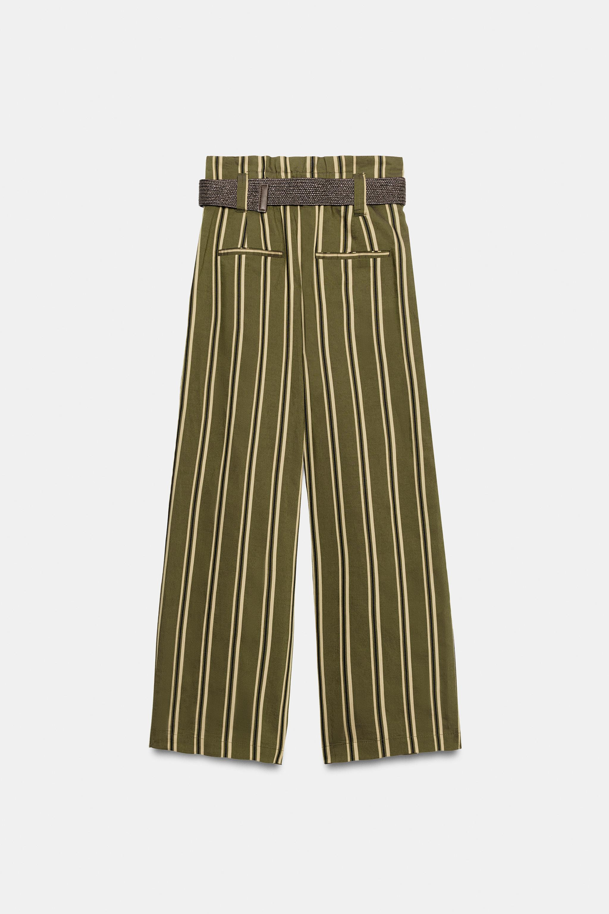 High-waisted trousers with pleats and a belt. Elasticated back. Front pockets and decorative welt... | Zara US