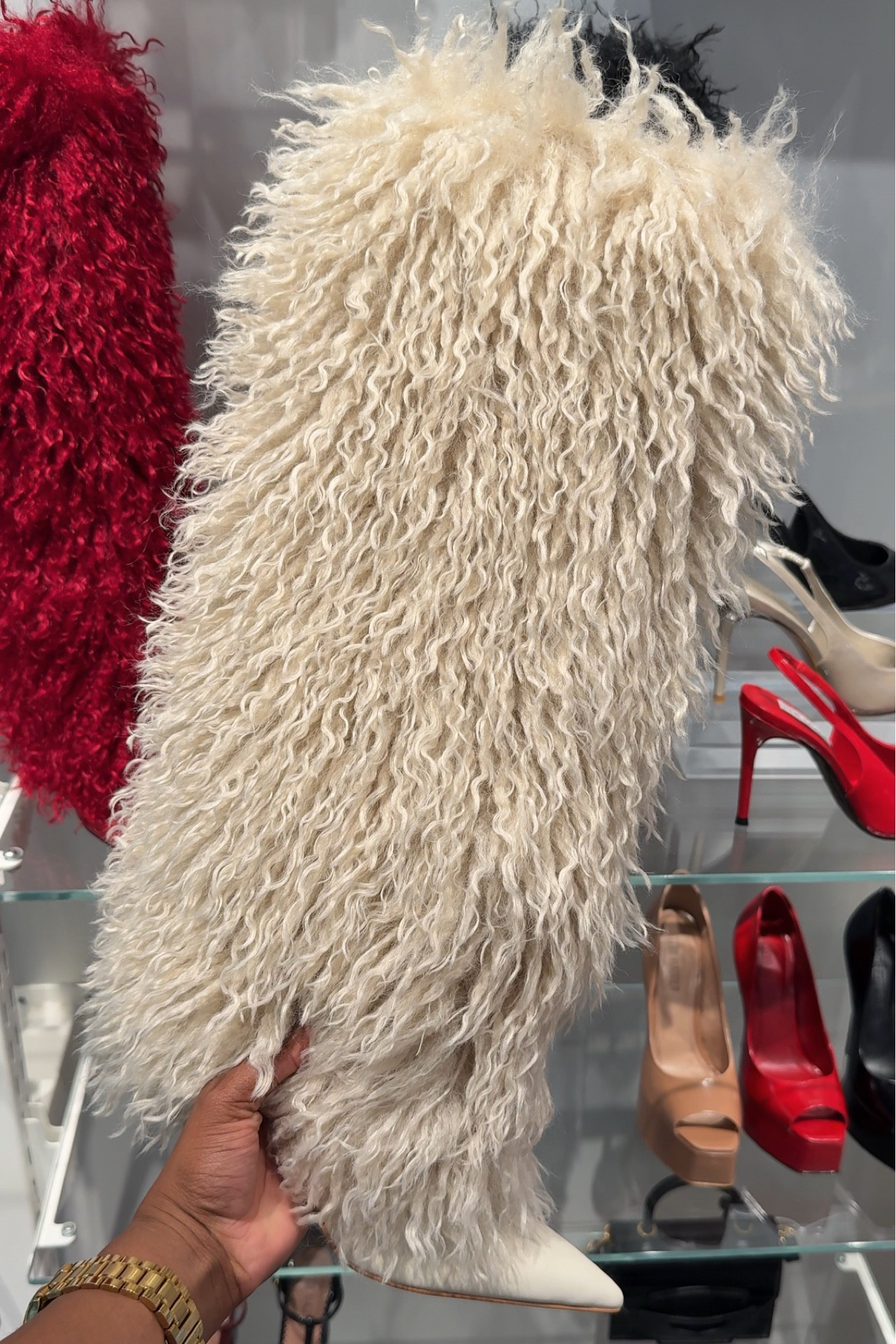 Steve Fur Cuff Boots 
Go a half size up for extra room. I am a 7.5. I went with a size 8. The heel height is 3.75 inches. They are comfortable to walk in and come in black, off-white and red  

#LTKFallSale #LTKShoeCrush #LTKSeasonal