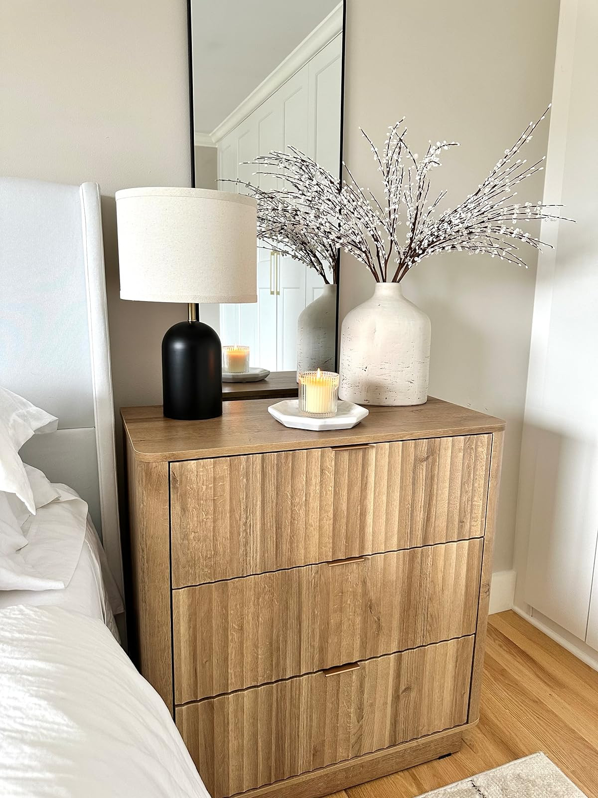 This set of two bedside lamps have 3 way touch control and 2 usb ports for charging! So affordable and looks beautiful! Loving my new fluted nightstands too. Styled here with a marble tray, fluted candle, spring jasmine stems and a black arched mirror! | Amazon (US)
