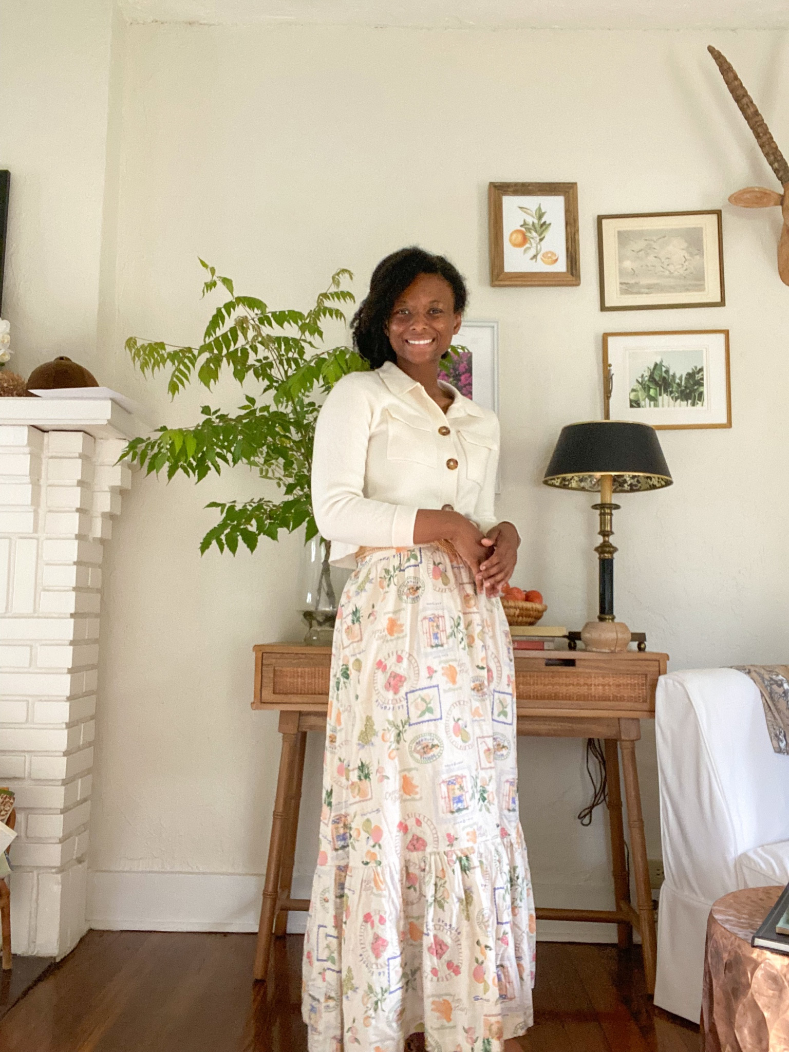 Loving this outfit. This skirt is such good quality, especially for the price. I was shocked! The print is a beautiful Capri Italy print with lots of fruit and coastal views. This skirt is only $70. I love it paired with a woven belt and this Sezane cardigan/sweater 

#LTKSeasonal #LTKstyletip #LTKfindsunder100