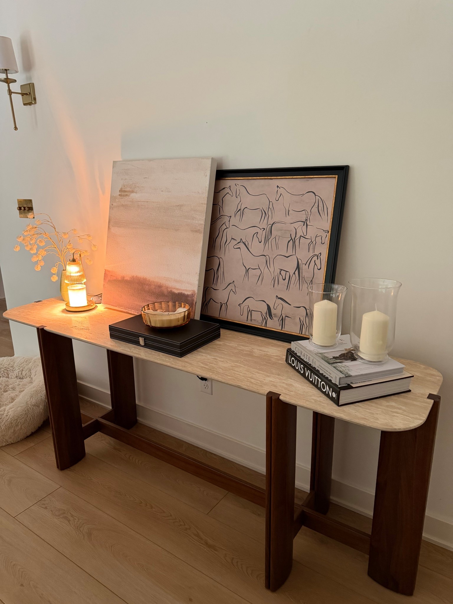 Entryway moment 🤍✨
the first little glimpse when you walk in

Styled this table with layered art and a candle warmer (my favorite way to make the house smell good without lighting anything). It feels simple but still intentional.. the kind of space that instantly makes your home feel cozy and put together 🕯️🏡

linked everything here ✨

#LTKHome