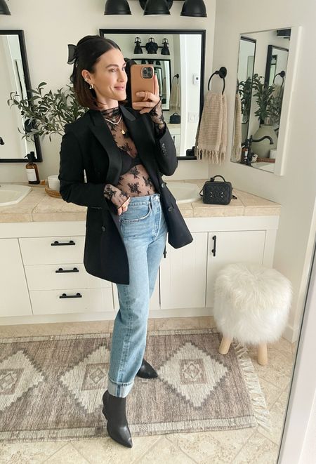 FASHION \ date night winter look! Mixing classic denim with a fun lace top and oversized black blazer💁🏻‍♀️

Outfit 
Jeans
Boots 

#LTKstyletip