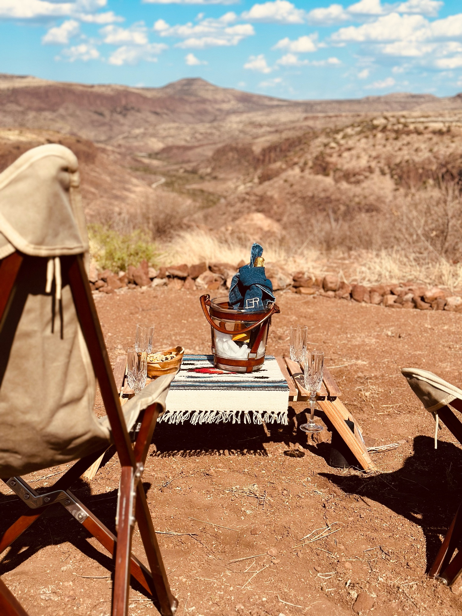 Tonight we celebrated the engagement of some of our favorite people! I pulled out this gear that you have seen before - I use it all often. 

One of the things I live most about this fold-flat table is the glass holders! Created for wine or champagne glasses, it actually holds them well and leaves room for snacks, phones and other gear. 
I turned this wool Mexican placemat sideways to cover the umbrella hole and to create a visual place for our ice bucket.
Cheers! 

#LTKhome #LTKtravel #LTKFind