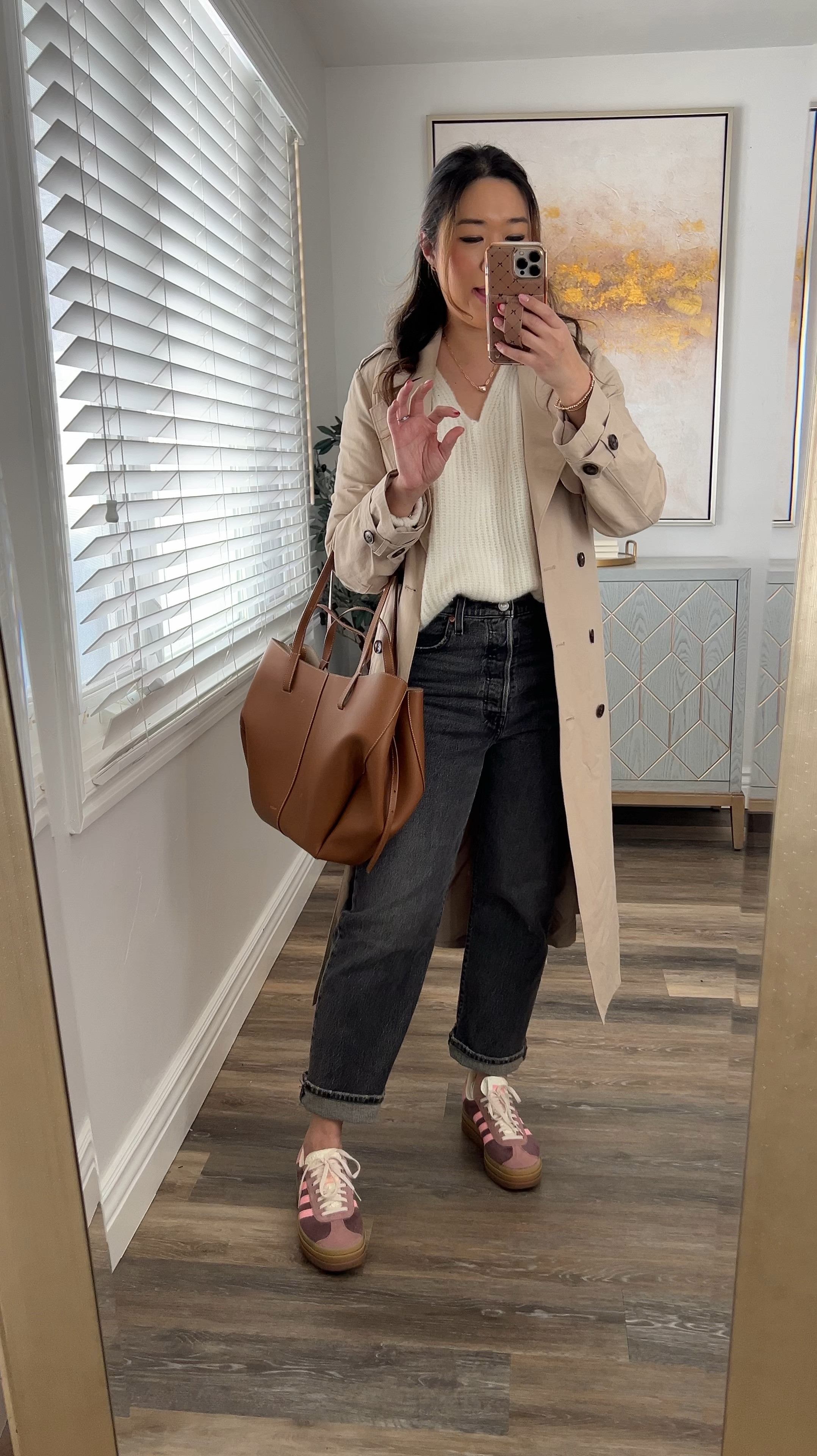 Sweater: Medium
Jeans: 29
Trench Coat: Small
Adidas: Size down one size