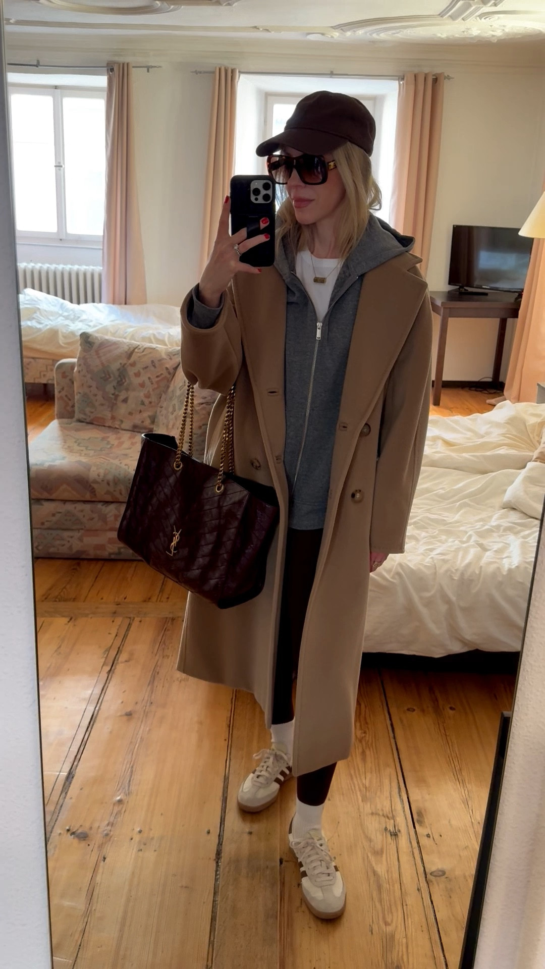 Travel look, airport outfit, camel coat, gray hoodie sweatshirt, chocolate brown leggings, burgundy YSL tote bag, casual chic spring look

#LTKActive #LTKmomlife #LTKTravel