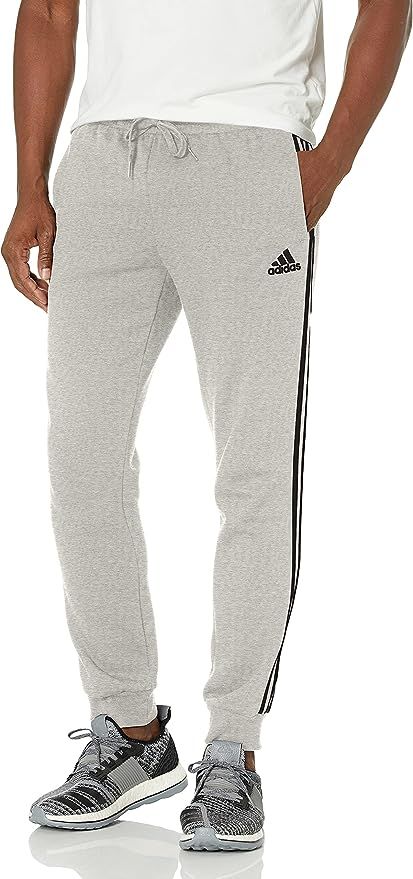 Amazon.com: adidas Men's Standard Essentials Fleece Tapered Cuff 3-Stripes Pants, Medium Grey Hea... | Amazon (US)