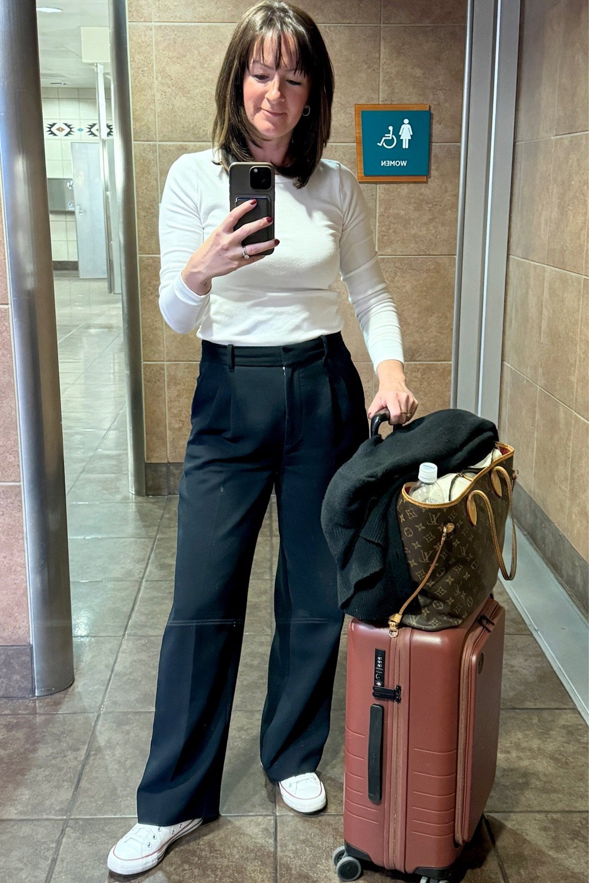 My go-to travel outfit. Effortless Pants and a long sleeved tee. For long haul flights, overnight flights or quick trips this outfit is super comfortable and keeps me warm on the chilly planes  

#LTKover40 #LTKtravel #LTKstyletip