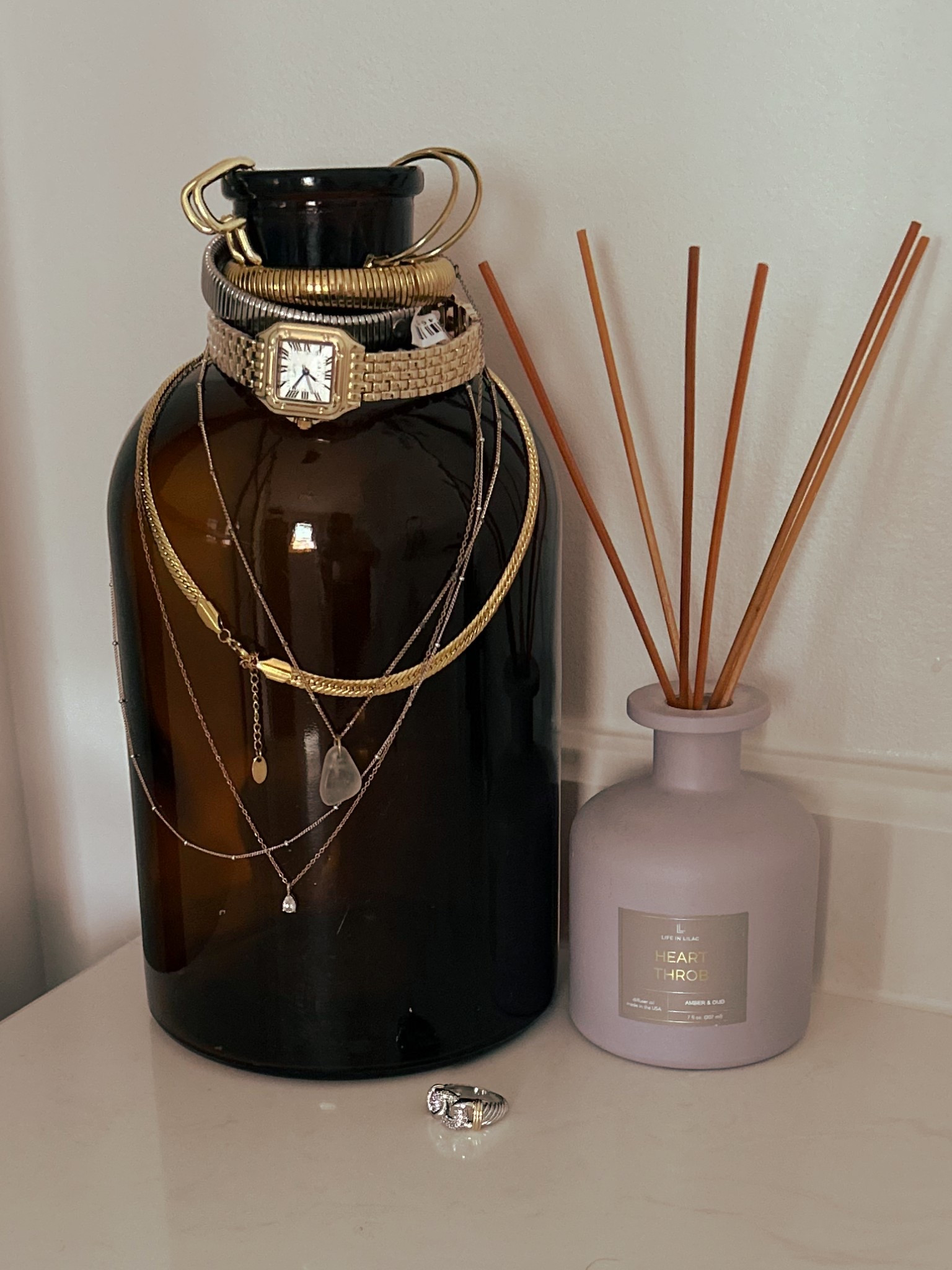 Grab a jar you have around your house or run to goodwill or an estate sale and use it for your jewelry!! Sooo cute ! 

#LTKStyleTip