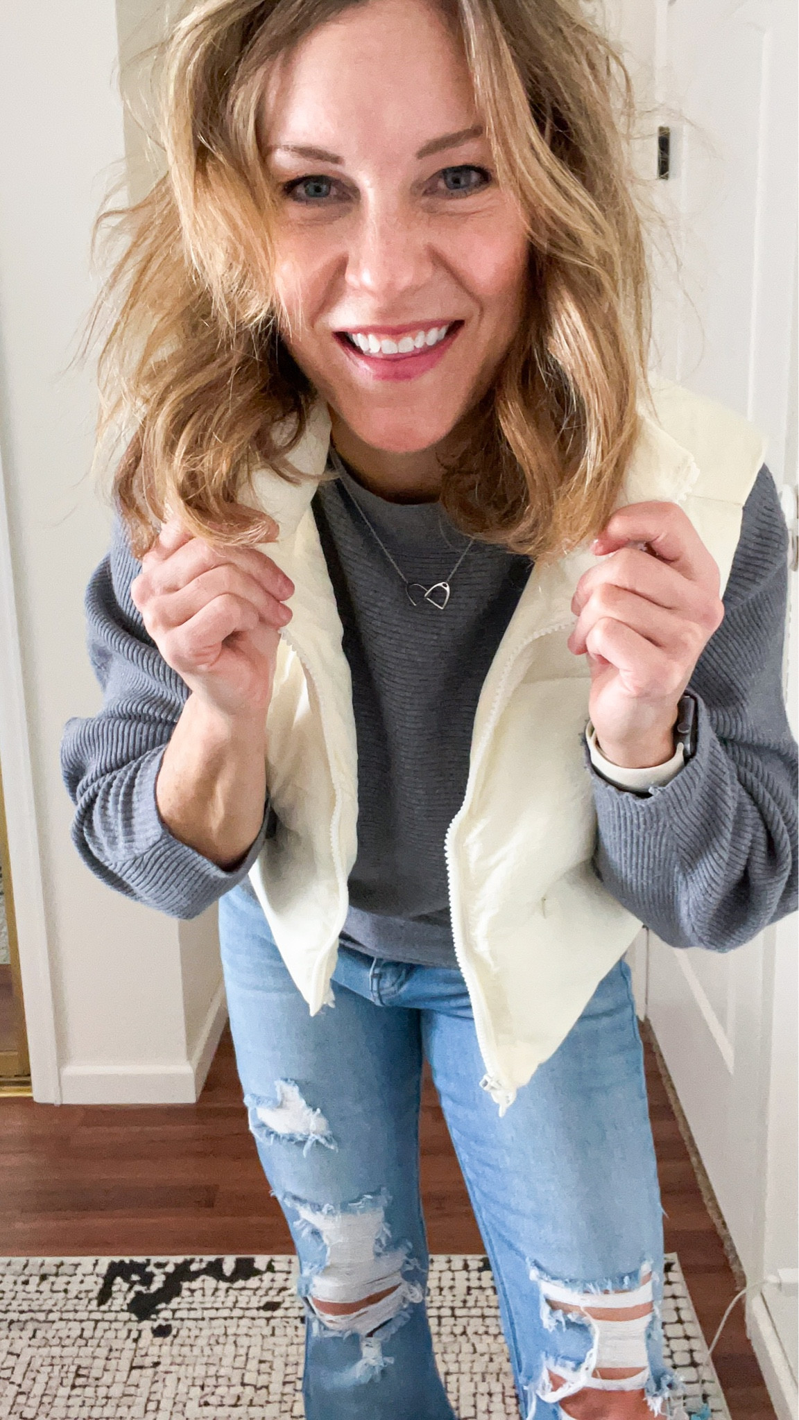 Winter requires a vest. My cropped big collar zip up puffer vest comes in a variety of colors- I own black, beige, and hot pink. This batwing sweater is a favorite- soft and forgiving but still has shape! Jeans linked as well. #winteroutfits #croppedvest #puffervest

#LTKSeasonal #LTKstyletip #LTKsalealert