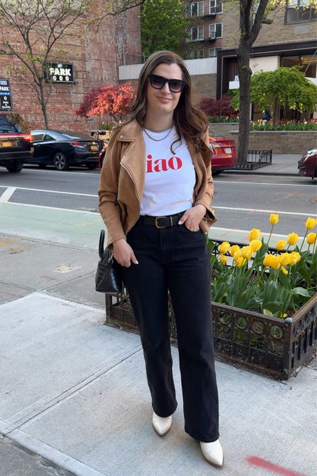Try elevating a graphic t-shirt by tucking it into a pair of jeans and layering a suede jacket on top. A sleek pair of boots and silver jewelry completed the look  

#LTKfindsunder100 #LTKstyletip
