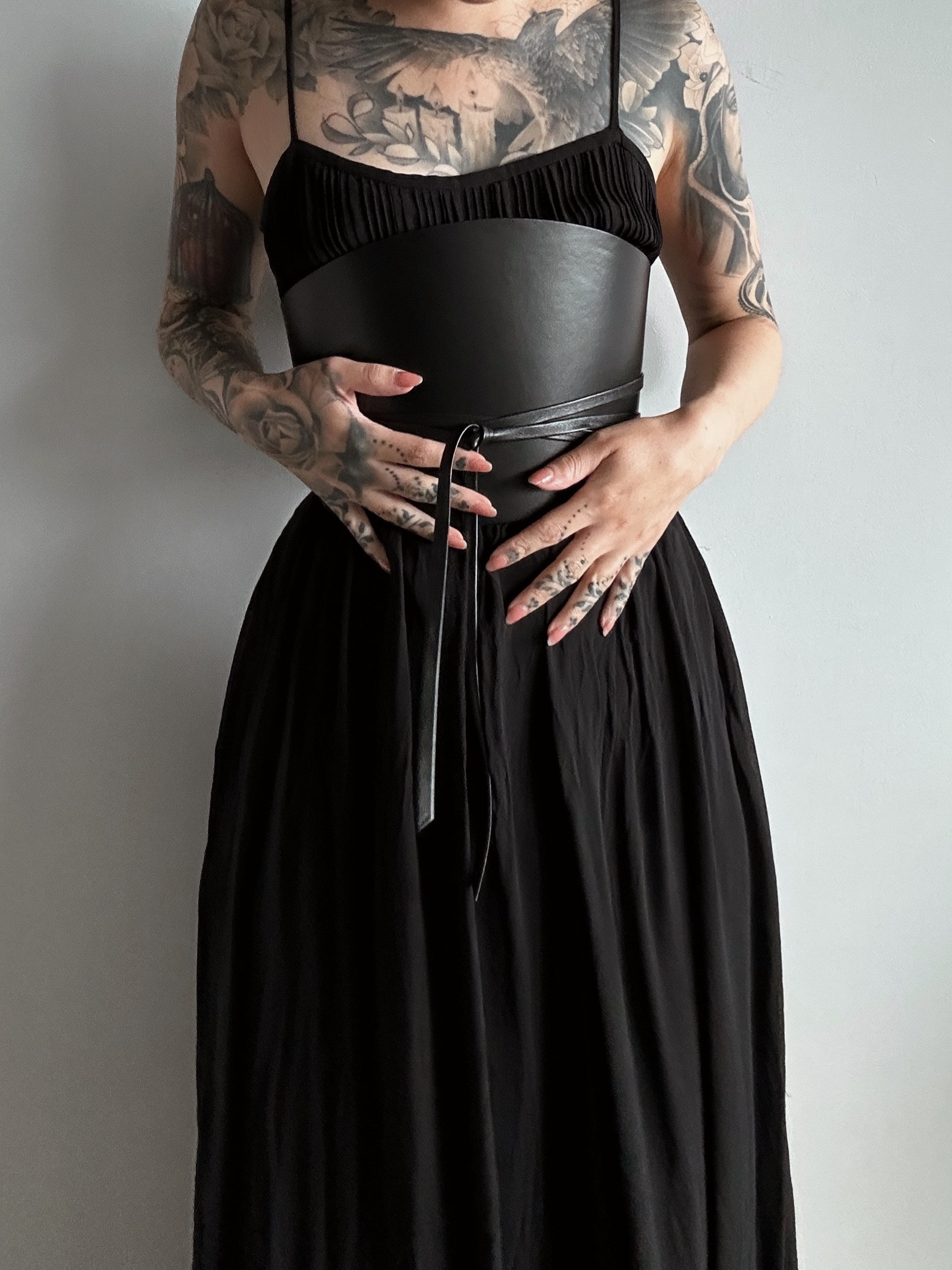 Black pleated dress and black leather corset belt 

#LTKSeasonal #LTKstyletip #LTKFind