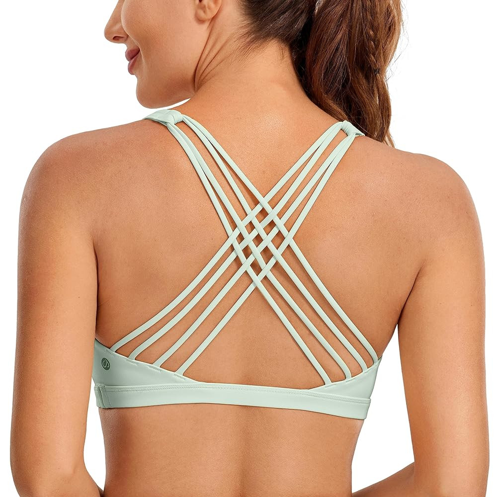 CRZ YOGA Strappy Sports Bras for Women - Criss Cross Back Wireless Padded Yoga Workout Cami Top | Amazon (US)