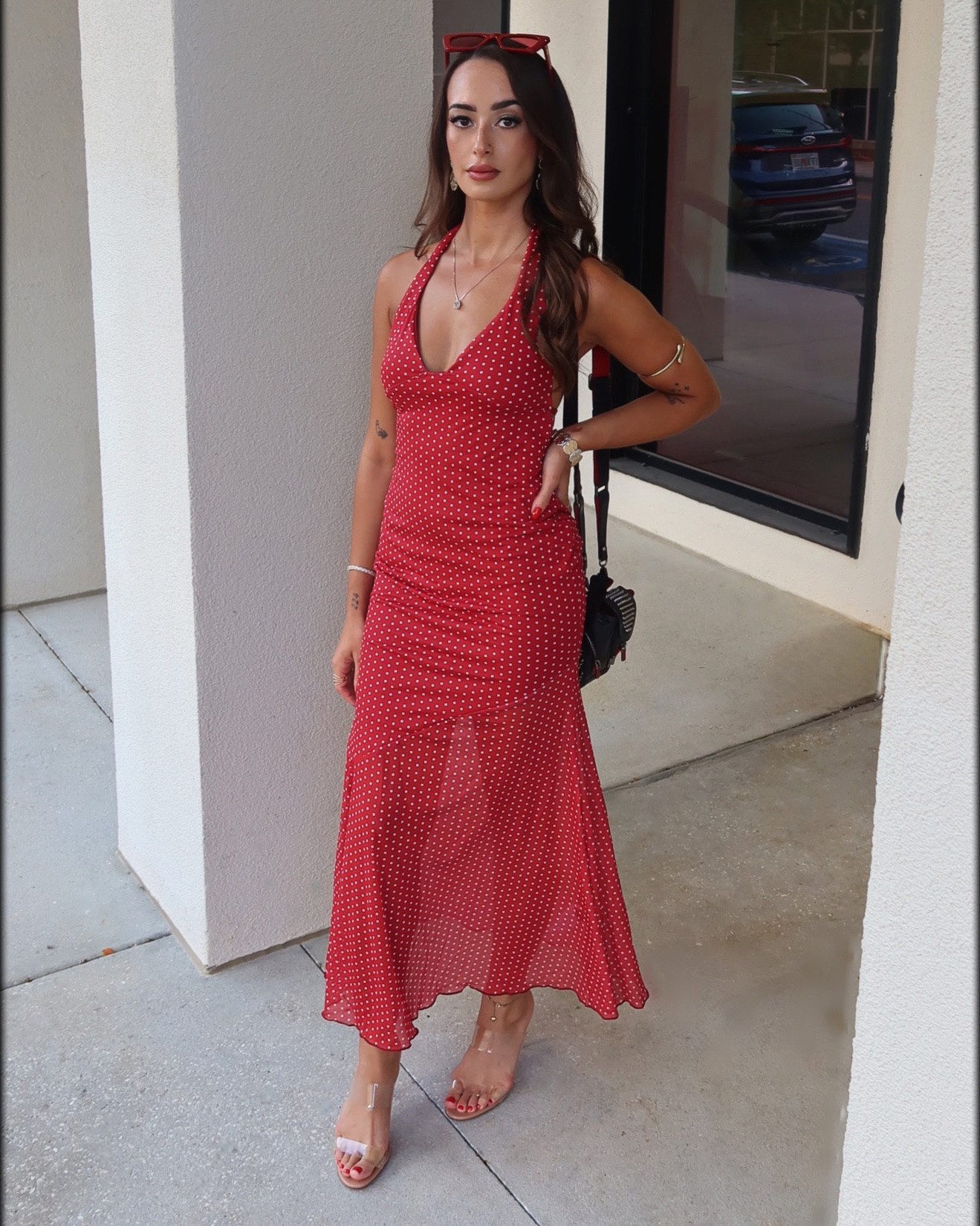 The kind of dress that does all the work for you ❤️‍🔥 This red polka dot halter maxi dress is fitted in all the right places with the prettiest open back and flowy sheer skirt. The perfect summer maxi dress for vacation outfits, date night, dinner outfits, European summer style, girls trips or a summer wedding guest look. Styled with clear heels, red sunglasses + a statement mini bag for an easy elevated summer outfit.

#LTKootd #LTKSeasonal #LTKTravel