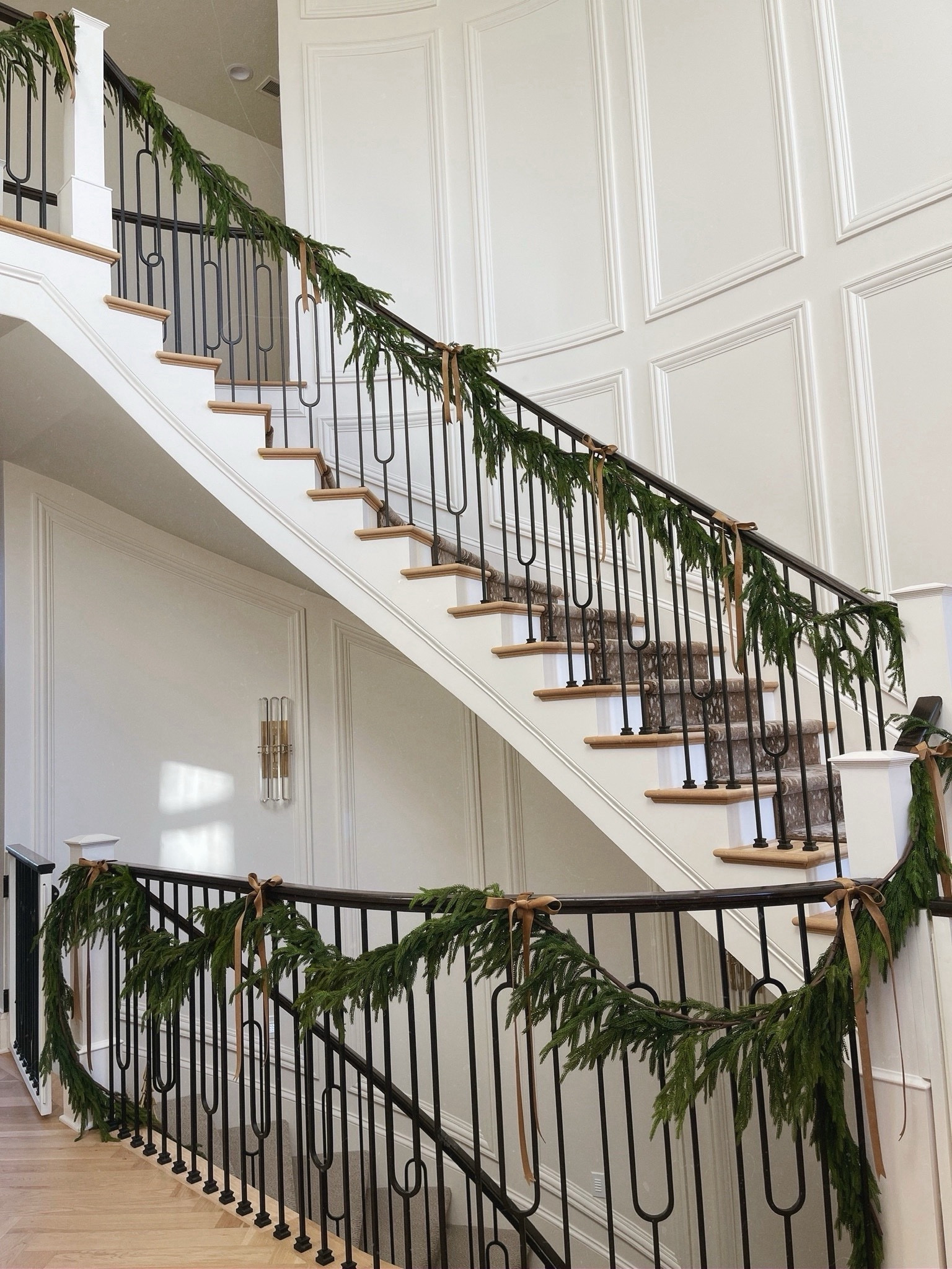 Holiday railing garland is back in stock! The Norfolk pine looks so real and I love the velvet bow