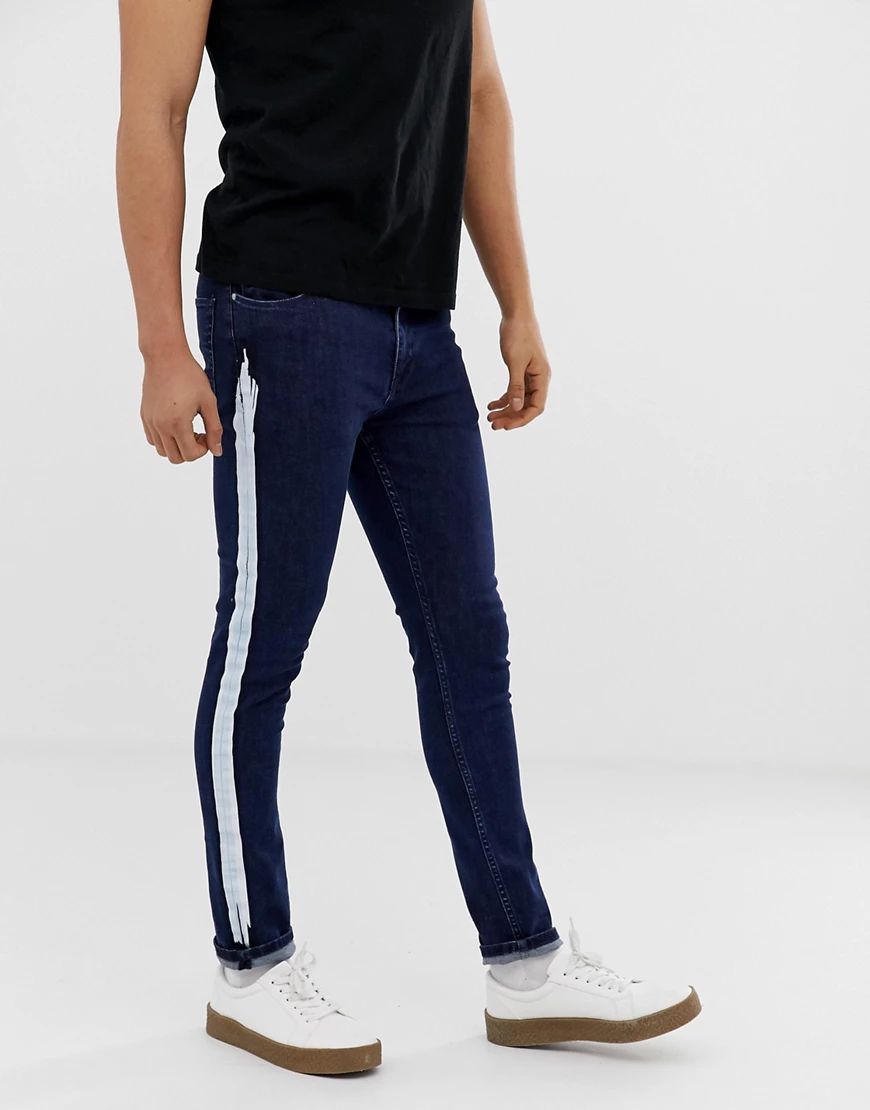 ASOS DESIGN super skinny jeans with white stripe in indigo-Blue | ASOS (Global)