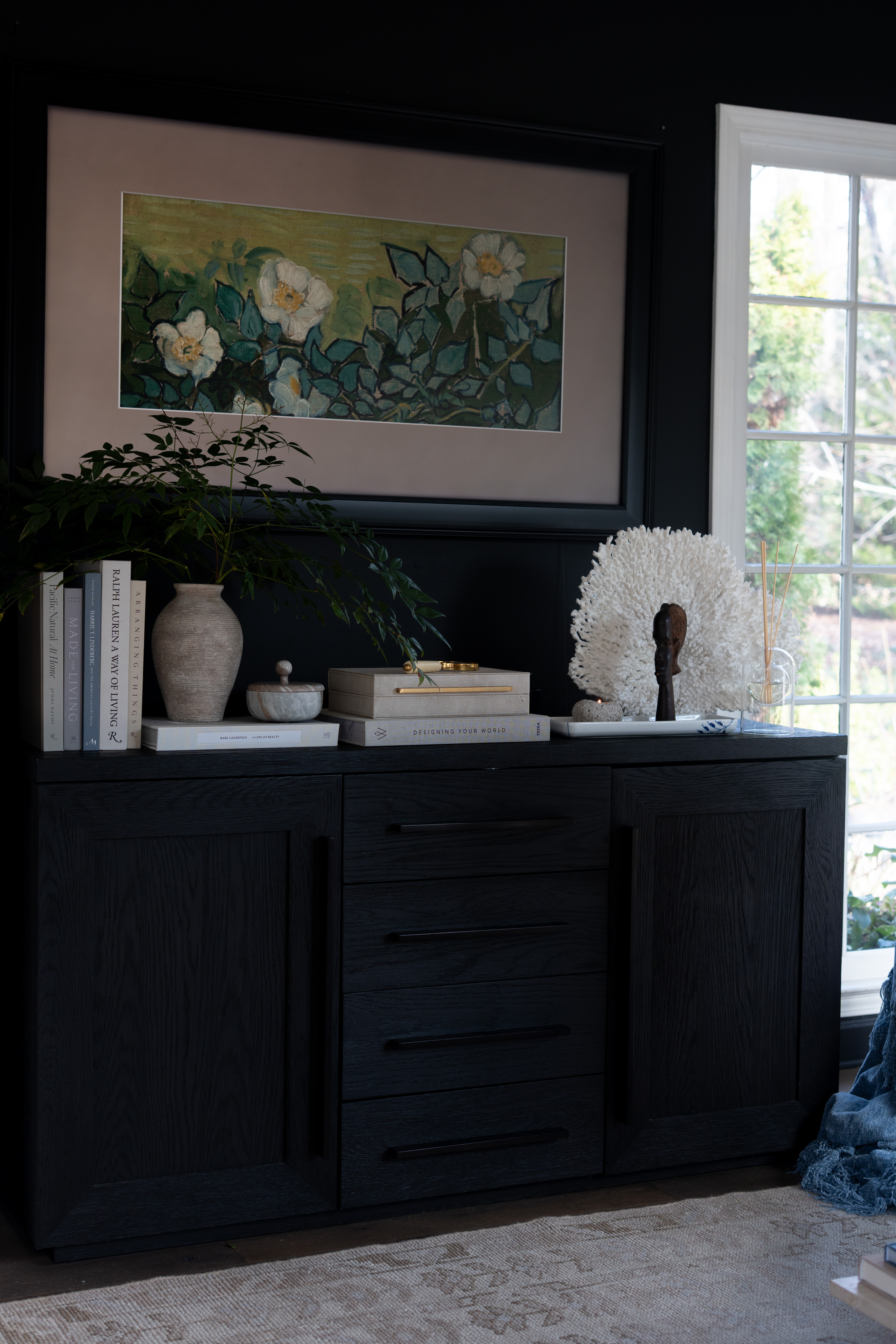 This corner came together so beautifully. The styled console with greenery, books, and natural textures creates a calm foundation, while the Frame TV above it blends in like part of the gallery wall. 

 #LTKSpringSale #LTKSeasonal #LTKHome