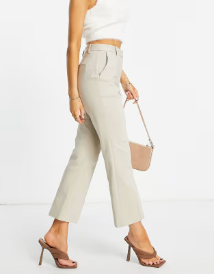 NA-KD kick flared pants in beige | ASOS (Global)