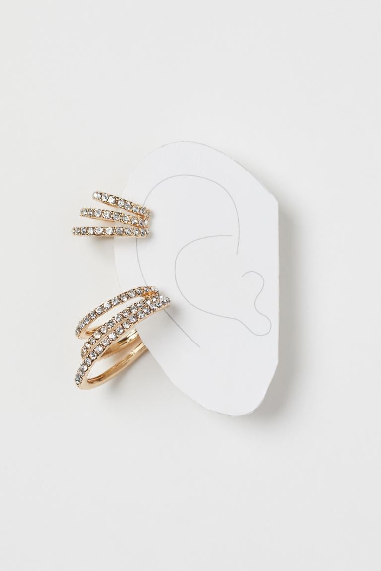 Wide metal ear cuffs embellished with glass rhinestones. | H&M (US)