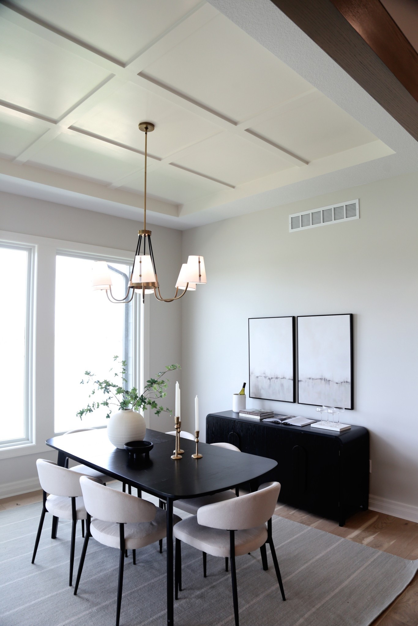 Who knew a dining room could look this good! Canvas wall art, Side buffet table, Glass accents, Overhead Lighting, Planters, Greenery, Candles, Dining table, Chairs  

#LTKHome #LTKStyleTip #LTKFamily