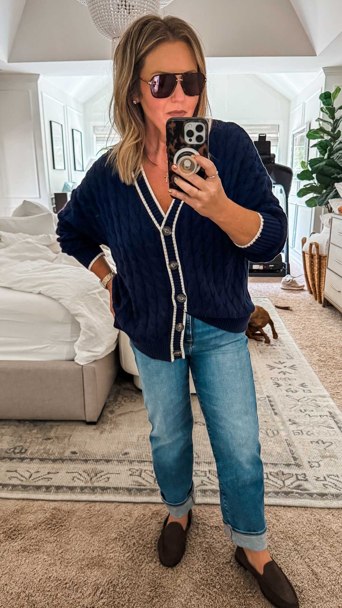 This navy cable knit cardigan sweater is so versatile for the season and can be dressed up or down, depending on the occasion. I’m wearing my regular size for an oversized fit and it’s the perfect weight to wear for work, outdoor events and more. Here I’m wearing this sweater with my favorite jeans and loafers. ladies outfit casual outfit fall outfit gift idea for her aviator sunglasses 

#LTKSaleAlert #LTKGiftGuide #LTKFindsUnder50