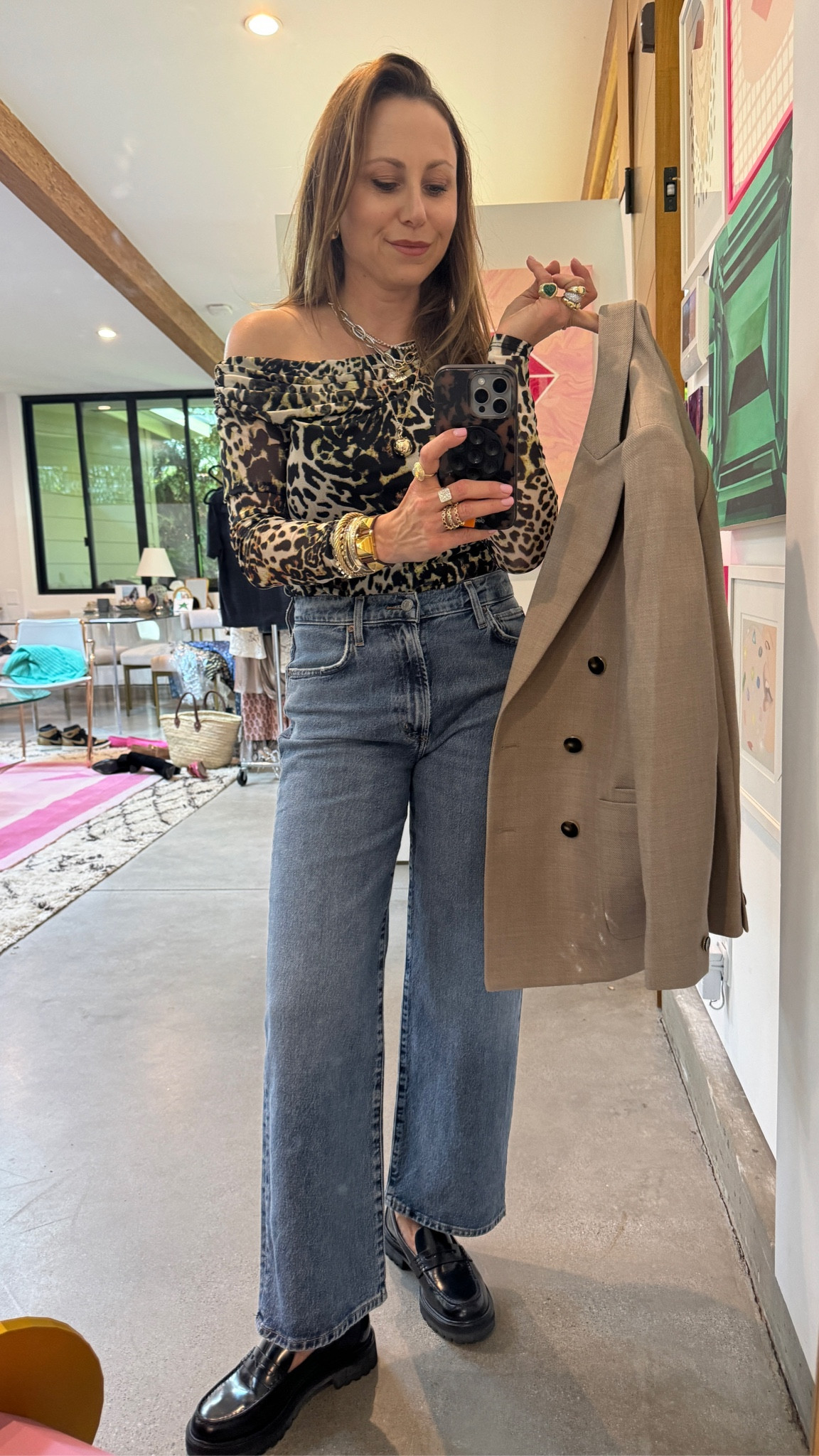 I am absolutely loving this look. There is something so clean and chic about a neutral look with an eye-catching pattern. When it comes to pattern play, I am all about leopard print. This leopard off-the-shoulder shirt goes so well with the look and the trenchcoat ties it all together perfectly. #LeopardPrint #Trenchcoat #Jeans #BootCutJeans #FallFashion #WinterFashion #FallLook #Autumn #OfficeWear #Workwear