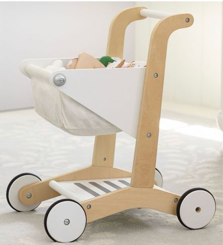 Made of wood and cloth, this stylish shopping cart is kid-sized and checkout-ready. It's brought to you in collaboration with Pottery Barn Kids and helps your little one practice balancing, organizing and push-and-pull skills.

#LTKGiftGuide #LTKSaleAlert #LTKKids