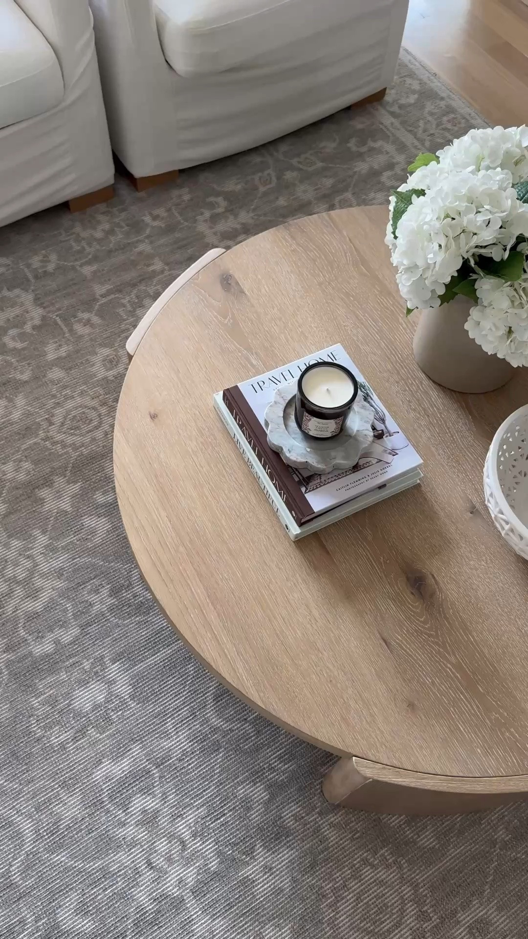 My top-selling coffee table for a reason. 🤍 The size, round shape, scale, and white oak finish make it one of my favorite pieces in our home. After nearly two years of daily life with a family of five, it still looks brand new—it's incredibly durable and has held up beautifully.

Also linking the pieces that complete this cozy living room: my neutral patterned rug (a favorite for high-traffic spaces), the ceramic lattice bowl that's beautiful styled or filled with fruit, and my go-to beige crock with faux hydrangeas for an effortless, timeless centerpiece.

#LTKSaleAlert #LTKHome #LTKdayinmylife