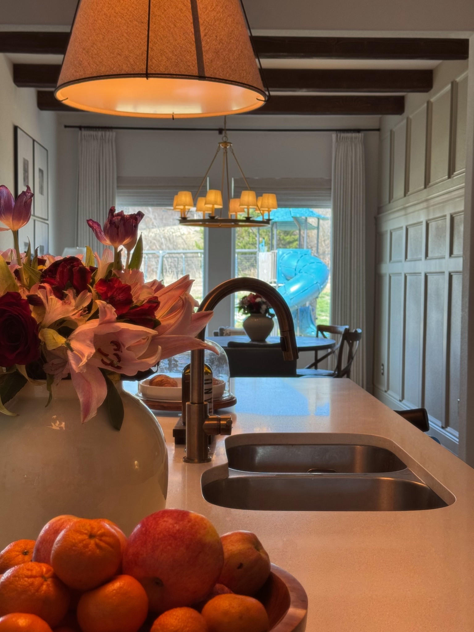 Kitchen view, white kitchen, cozy home, pendant lights, kitchen faucet, dining room, dining chairs, faux beams

#LTKmomlife #LTKHome