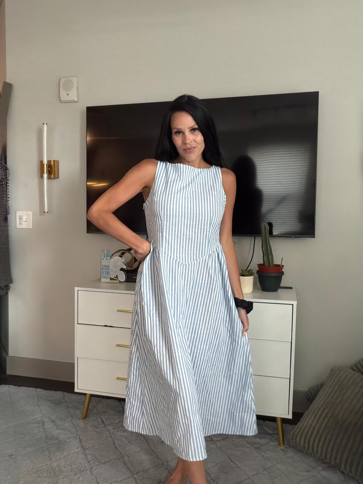 Obsessed with the effortless, breezy vibes of this blue and white striped midi dress! It features a classic high neckline and a flattering structured waist, making it the perfect choice for picnics, brunch, or warm sunny days. Share with a friend and click the link in my bio to shop the exact look! #LTKunder100 #SummerDress #StripedDress 

 #LTKdayinmylife #LTKgrwm #LTKootd