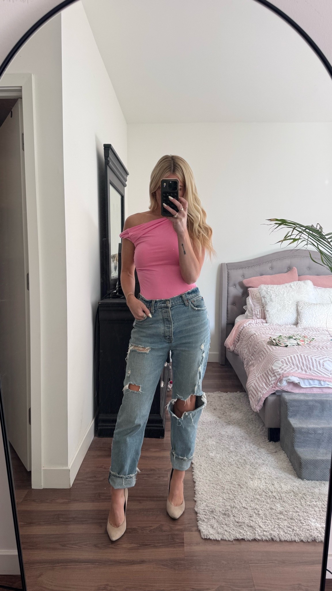 Pink one shoulder with oversized denim jeans and pumps.

#LTKootd