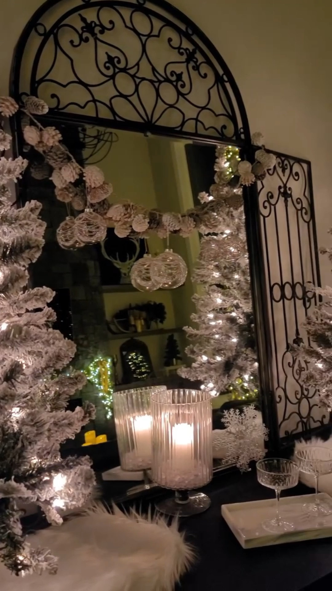 Here is another area where I continued the Winter Wonderland theme. It is a credenza or side board that has many uses. For this season, it is set up as a bar for special holiday drinks. I am looking forward to sharing those drinks with you soon.

A vintage mirror and faux fur give a luxurious feeling. Reflections of all the sparkle throughout the room make it more magical.

Christmas decor / Elegant Christmas decor / Flocked / Winter white decor /

#LTKHoliday #LTKHome #LTKFindsUnder50