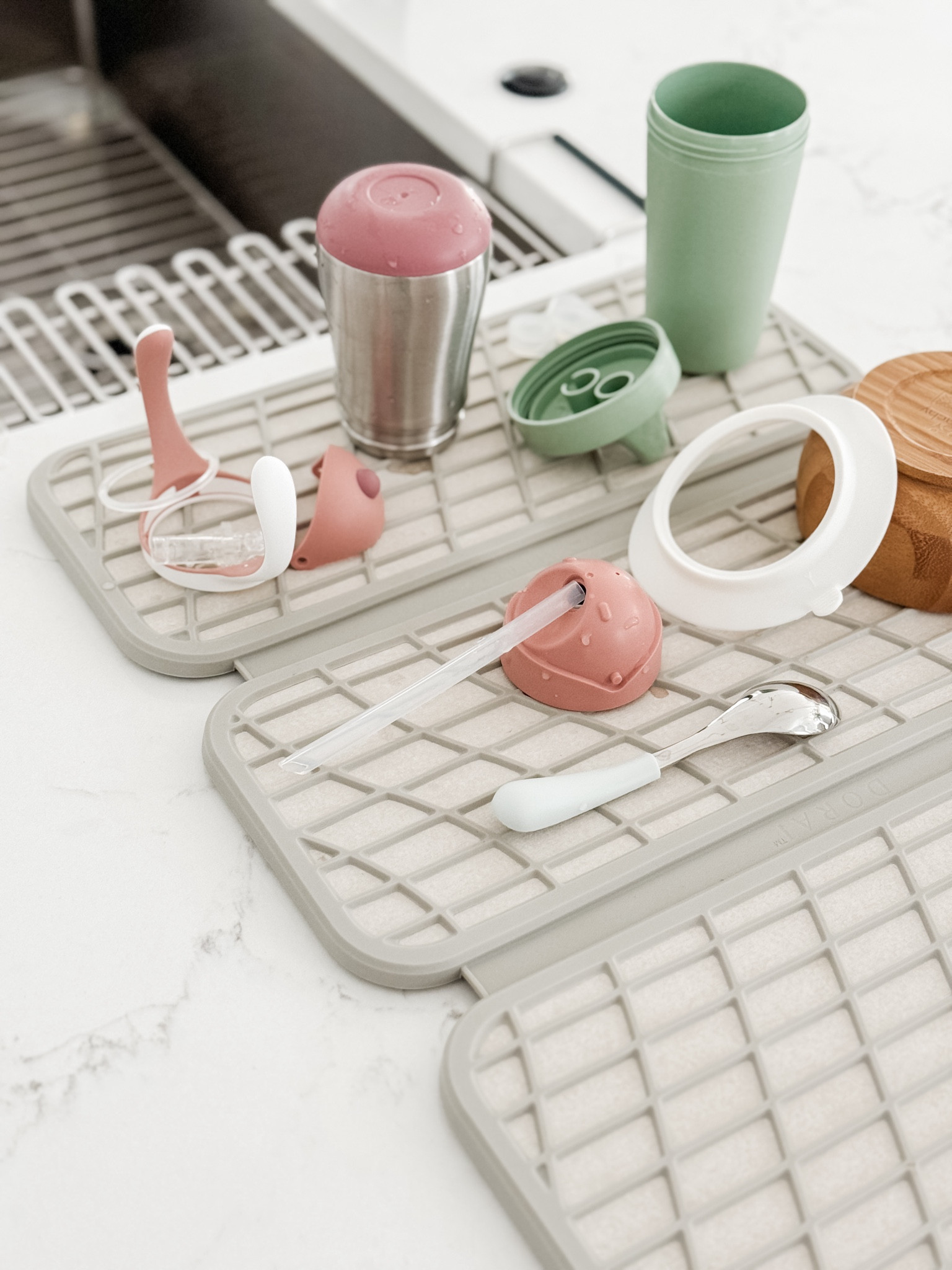 I adore these drying pads in our #LTKkitchen — they’re sturdy, naturally bacteria-resistant, the silicone webbing makes them soft enough to place more delicate items on and creates opportunities for ventilation. The best part is that the diatomacious earth material dries super quickly so as soon as you’re ready to put your dishes away, you can also fold up your drying pads and put them away too (without the risk of mildew!). 
This feels like such a random product to share, 😅 but they’ve been a major upgrade for us.

#LTKhome