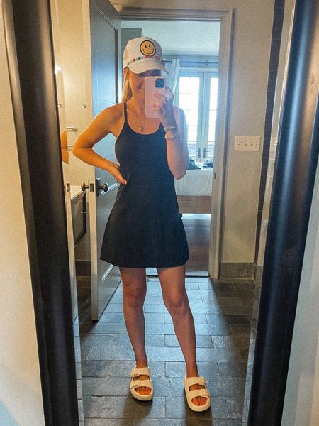 Summer casual outfit tennis dress amazon traveler dress trucker hat with charm comfy amazon sandal 

#LTKshoecrush #LTKtravel #LTKstyletip