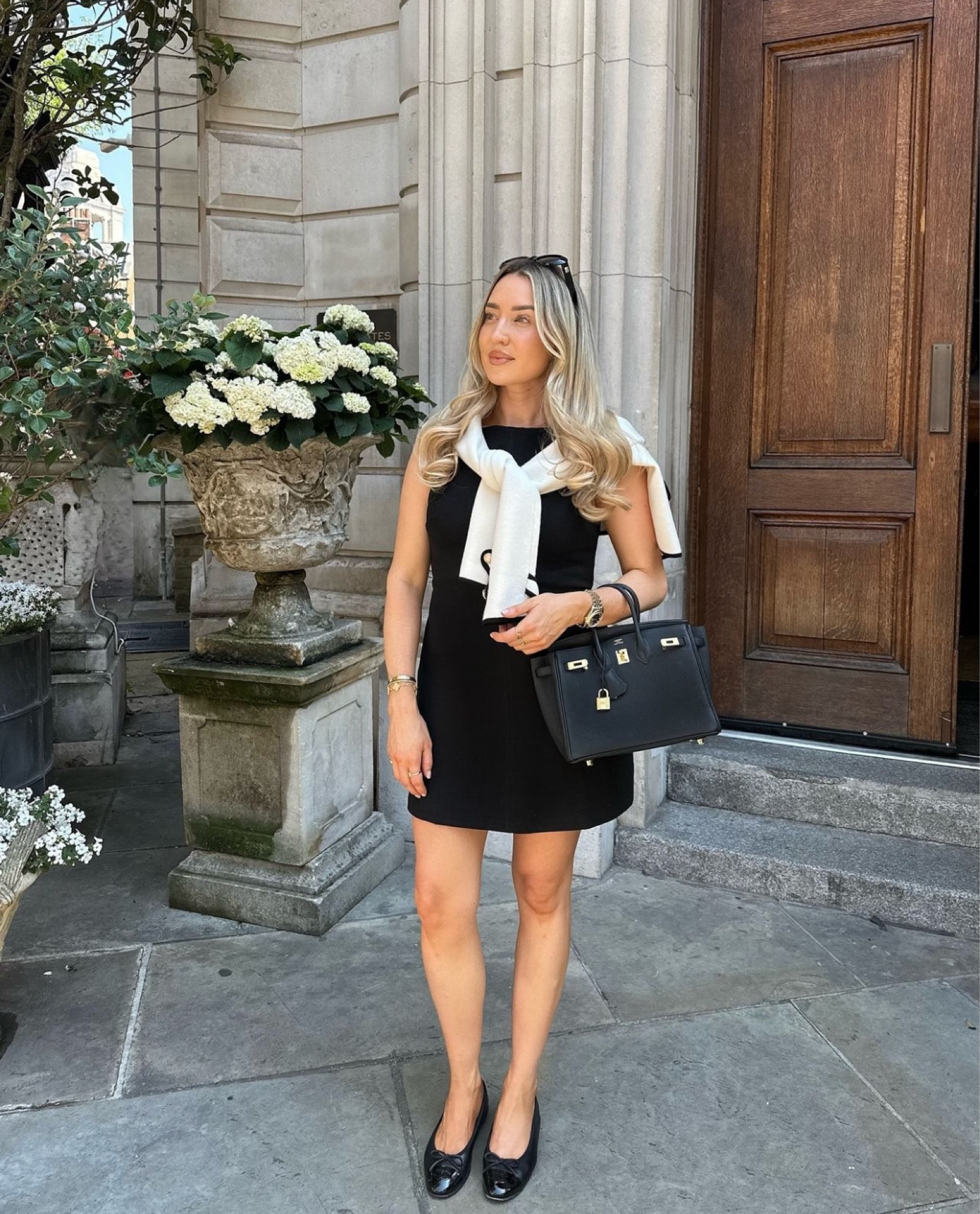 Little black dress, but make it city 🖤 chic transitional look with cardigan thrown over shoulders, black Hermes accessories 

#LTKworkwear #LTKsummer #LTKautumn