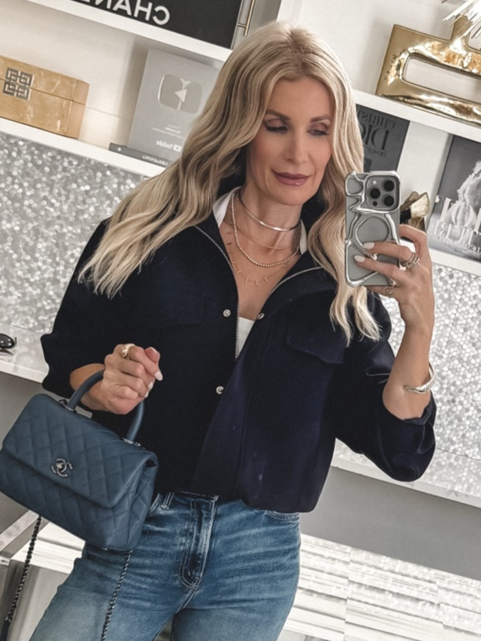 This navy blue bomber jacket is such a chic wardrobe staple and a great way to try the trending high-collar bomber jacket look. I love the polished crepe fabric because it’s wrinkle-resistant, easy to dress up or down, and perfect for travel, work, or everyday outfits. The navy shade is so versatile and feels fresh with denim and a simple white halter top. The jacket has an oversized fit, so I sized down to an XXS. I’m wearing a size 24 in the jeans and an XS in the white Aritzia halter top. #LTKStyleTip #LTKFinds
 

 

#LTKOver40 #LTKootd #LTKSeasonal #LTKOver40