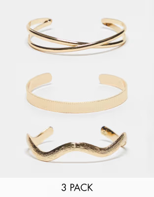 ASOS DESIGN 3-pack cuff bracelets with mixed designs in gold tone | ASOS (Global)