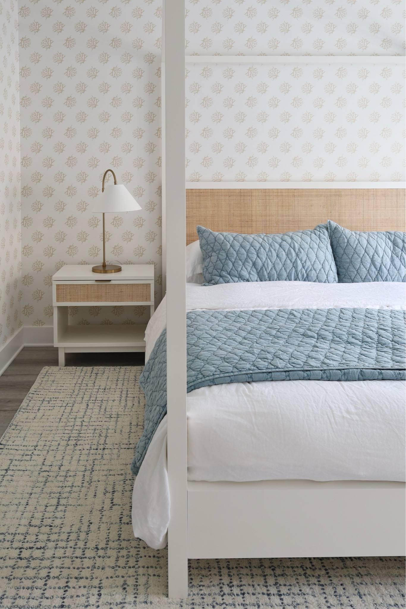 Pottery Barn Westly collection in a coastal home: canopy bed and matching nightstand; coral wallpaper and gooseneck lamp

#LTKHome #LTKSeasonal