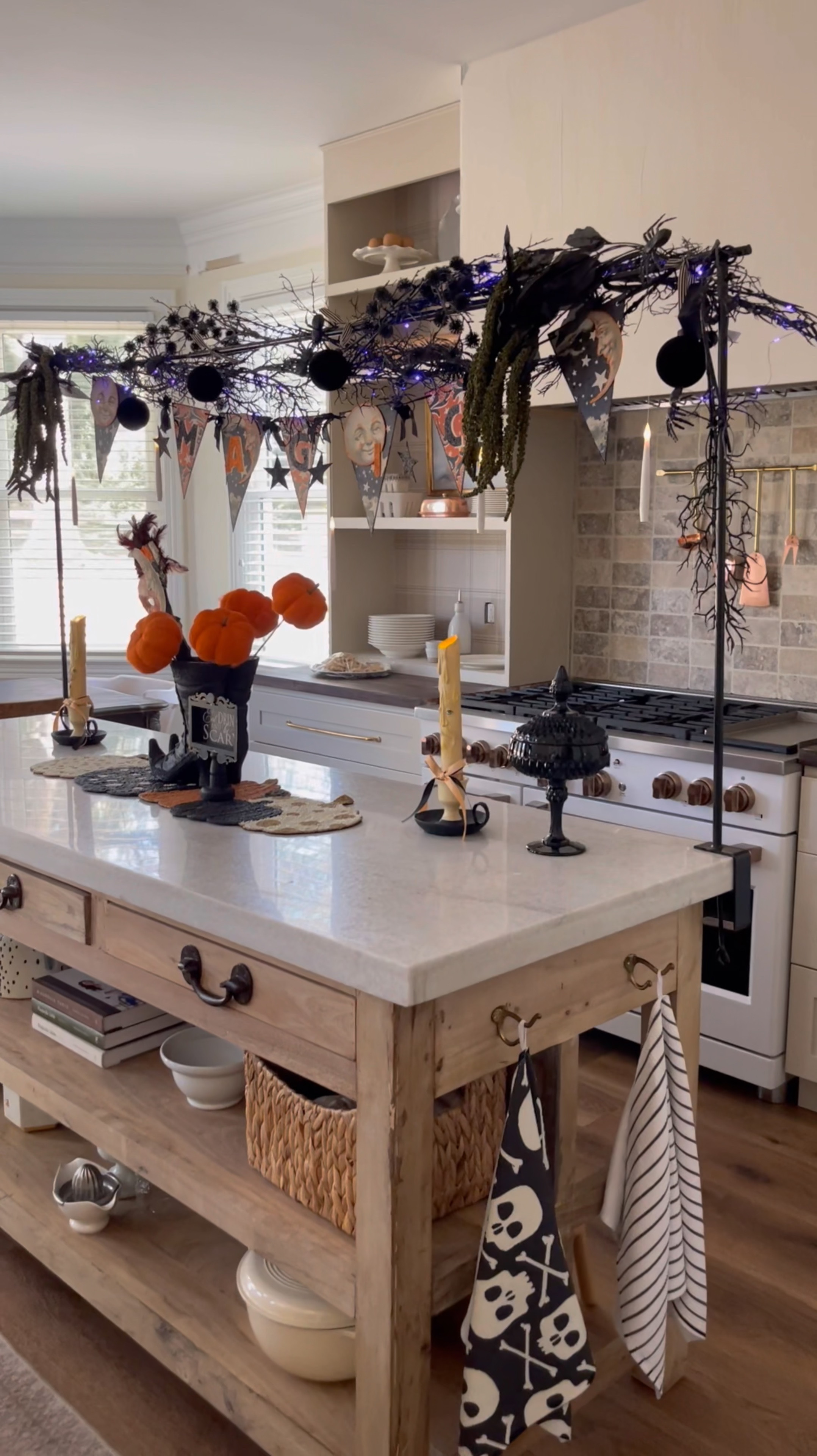 Halloween fun! Love this metal table top pole for the holidays! I use it for all the holiday decor. It can be used on top of a floating island like this or any table top rather dining or entry way. 

#LTKHome #LTKStyleTip #LTKSeasonal