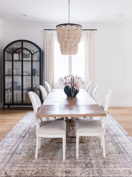 Dining room refresh. I swapped out my rug for something that has a little more depth and is super soft and cozy (the kids keep laying down on it! 😂) 

And now a moment for the arched beauty in the corner. I got rid of the bar cart for a more substantial piece and I can say it’s now my favorite piece of furniture in the house. I was originally going with a different cabinet but had a last minute change of heart- she’s perfect. 

Since changing out those pieces, I now think I need black dining chairs in this space 🙈 Anyone else feel like redecorating has a domino effect? You change one thing out and then…. 🙃

#LTKhome #LTKHoliday #LTKSeasonal