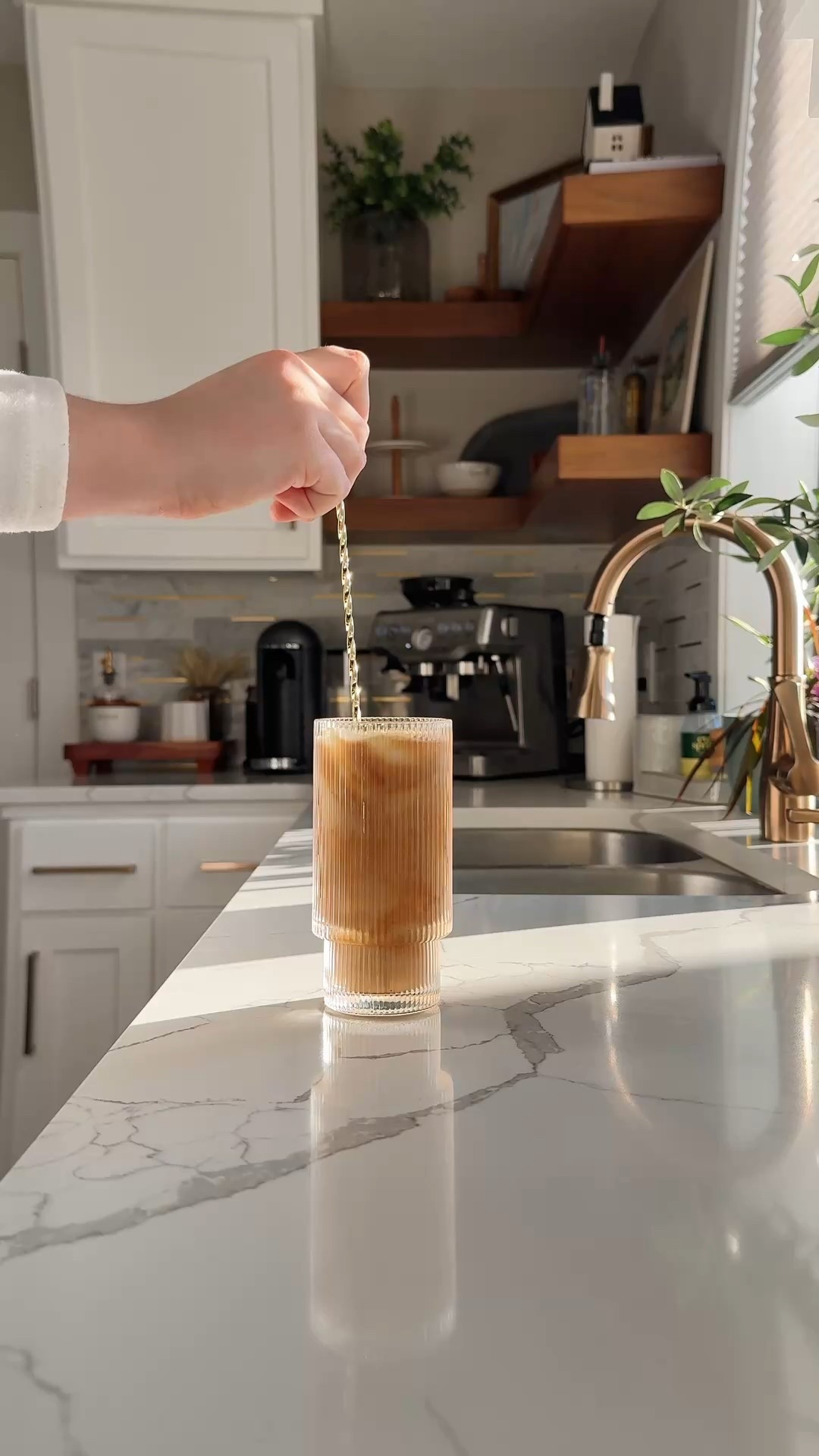 My go-to for making café-style iced lattes at home (and honestly worth the investment).

Breville Barista Express BES870XL in Light Silver ☕✨
Built-in grinder, milk frother, 15 bars of pressure — and that perfect crema every time.
