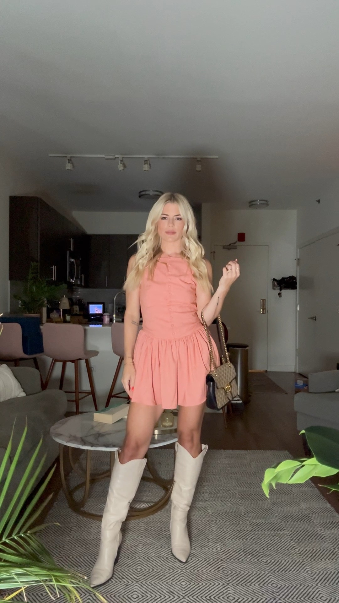 Salmon mini dress and white boots. Big wild concert outfit 