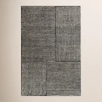 Balos Hand Tufted Black/Ivory Rug | Wayfair North America