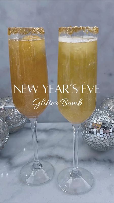 New Year’s Eve Glitter Bomb 

Rim champagne glasses with glitter/sprinkles. Pour your favorite champagne. Roll round ice cubes in edible glitter and then drop into champagne. Enjoy!🥂

#glitterbombdrink #glitterbombchampagne 
#glitterbomb #edibleglitter #nyedrink #nyedrinks #newyearsevedrink #newyearsevedrinks #champagne #newyears #balldrop #newyearseve #glitter #nye #glitterdrink #cocktail #cocktails #newyears2023 
#glitterbomb #happynewyear #welcome2024 #cocktailrecipes #newyear 

#LTKVideo #LTKparties #LTKHoliday