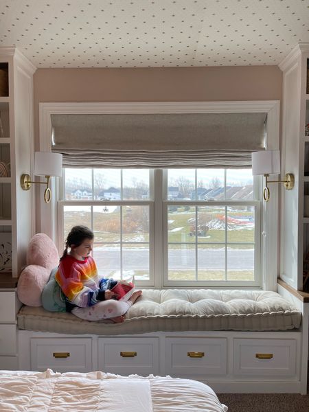 Beautiful cozy little girl’s bedroom, window bench, reading nook, bench seat, linen Roman shade, sconces 

#LTKhome #LTKfamily #LTKkids