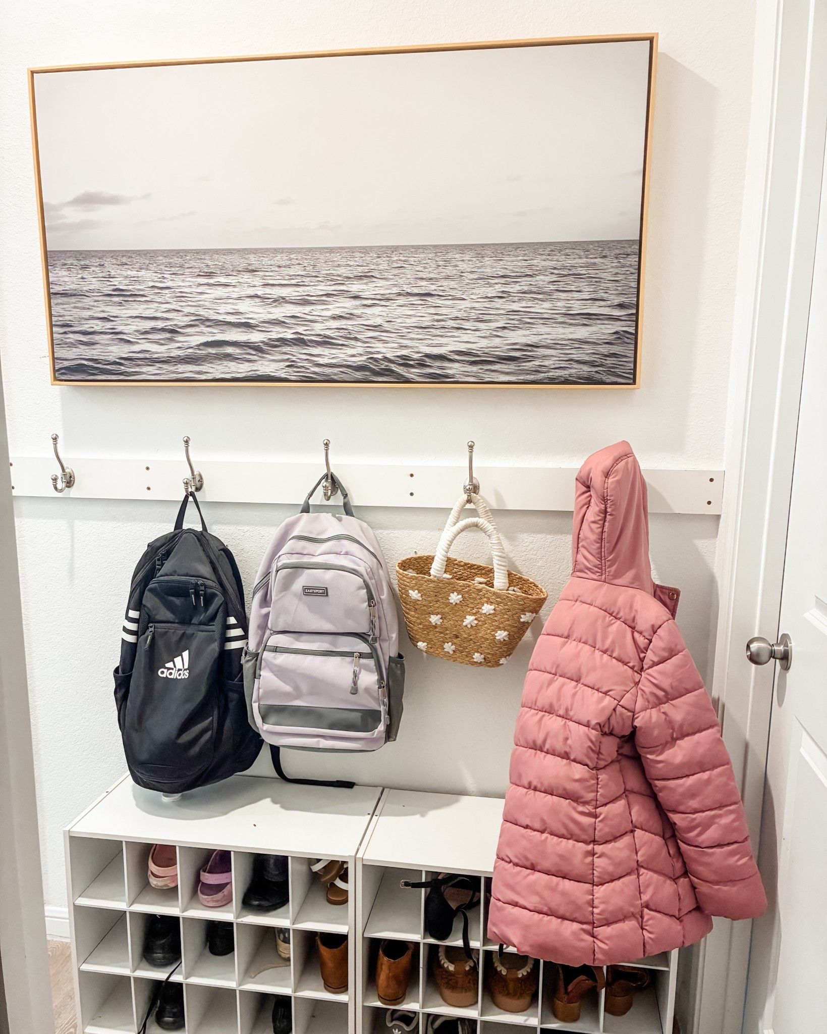 This area of the house is busy! These hooks and shoe organizer have worked well so far. To make it more interesting and inviting I added a picture of the ocean. I grew up in California and the coast was a beloved place! 

#LTKHome