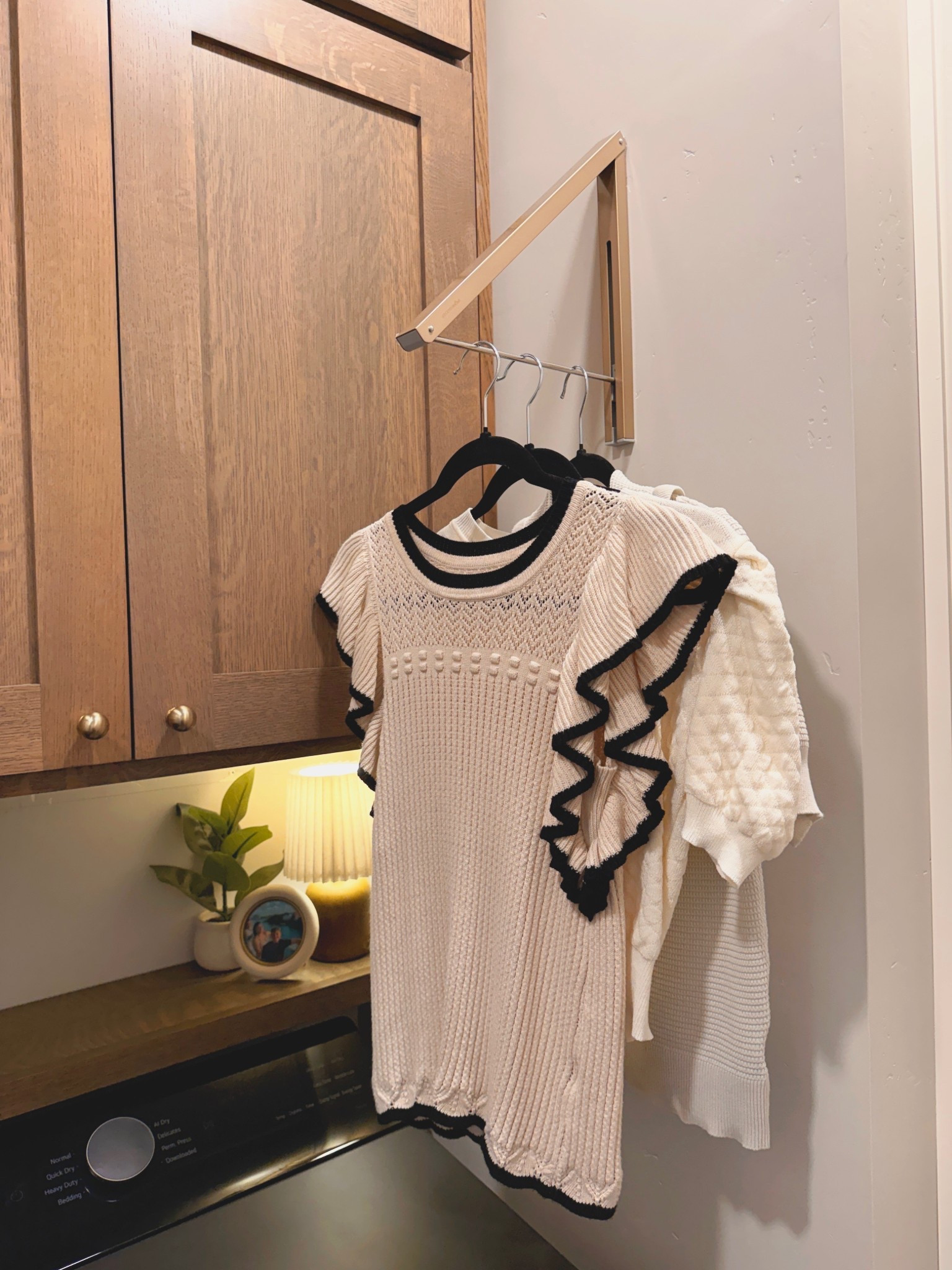 Laundry room, but make it cute. This little fold-down wall rack has been such a game changer for air drying sweaters and delicates without dragging out a bulky drying rack. It tucks away when you’re done and keeps everything off the counters.

laundry room organization, wall mounted drying rack, small laundry room ideas, space saving laundry, fold down drying rack, home organization, functional home finds

#LTKgrwm #LTKSeasonal #LTKHome