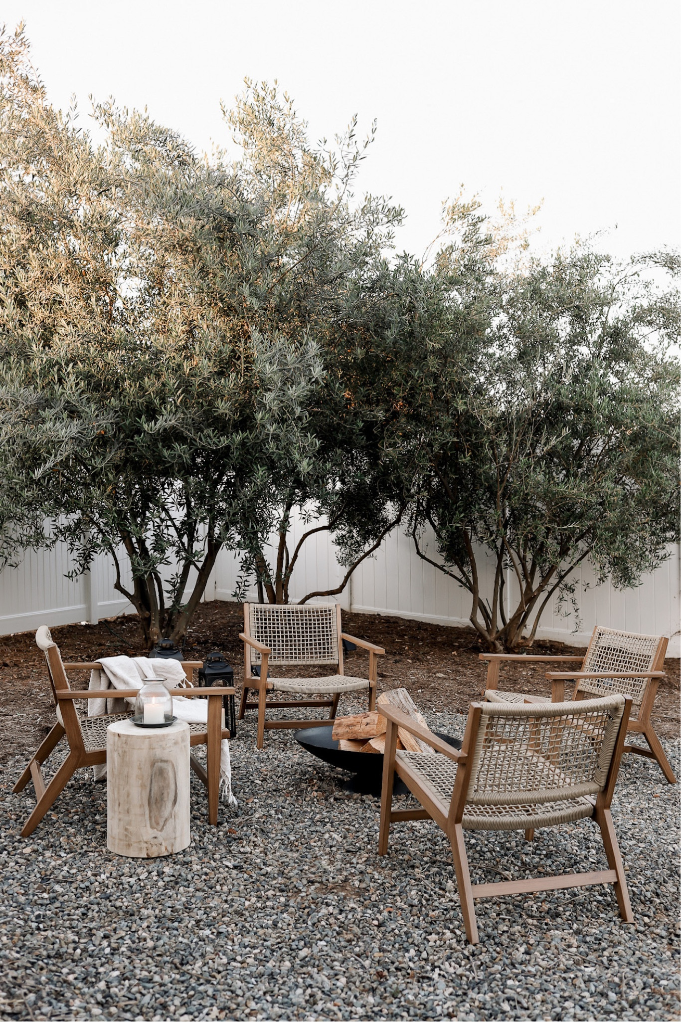 So excited about this outdoor fire pit lounge area in our backyard! It used to feel dirty and overgrown, but now it’s the perfect place for a summer night roasting marshmallows :) these chairs look like wood but are made of metal and they’re on super sale right now! 🥳 the fire pit is cast iron - amazing quality and also on sale! 

#LTKhome #LTKSeasonal #LTKsalealert